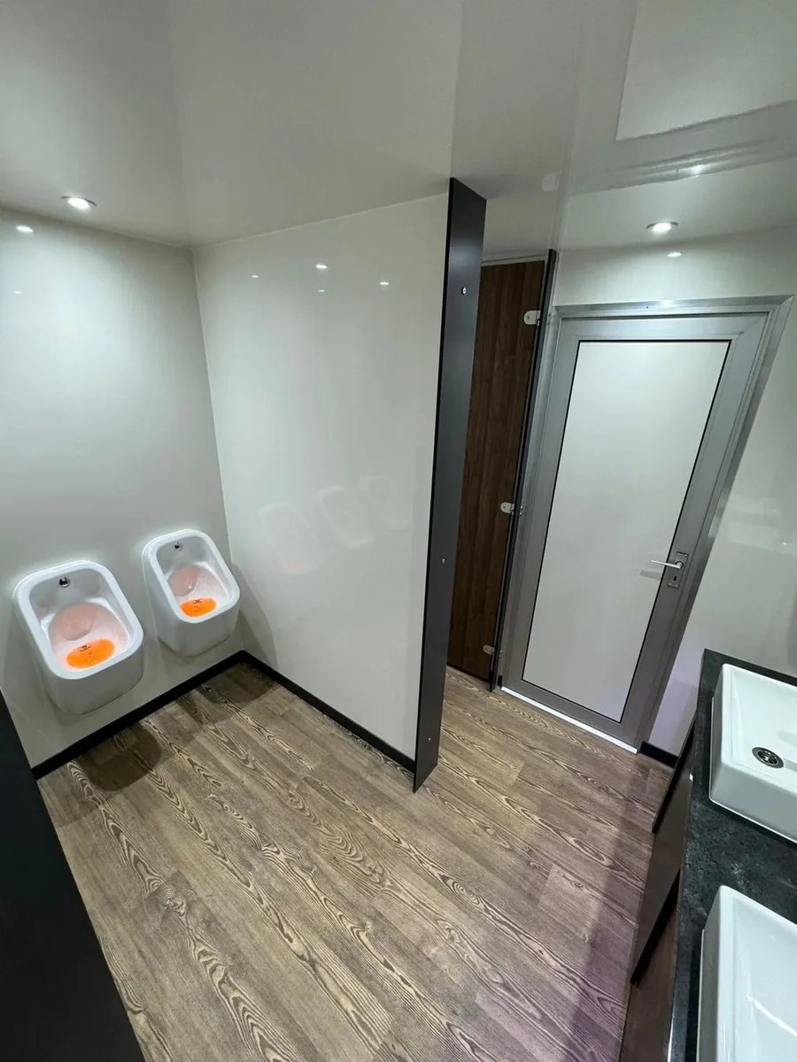 Vanity area with purple mood lighting inside luxury trailer